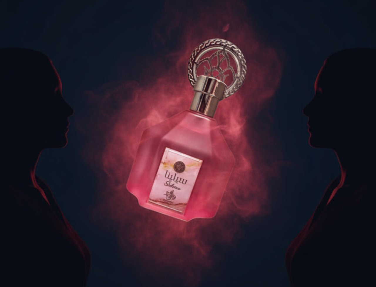 Al Wataniah Selena – Pink perfume bottle with ornate silver cap, surrounded by red mist, between two dark female silhouettes.