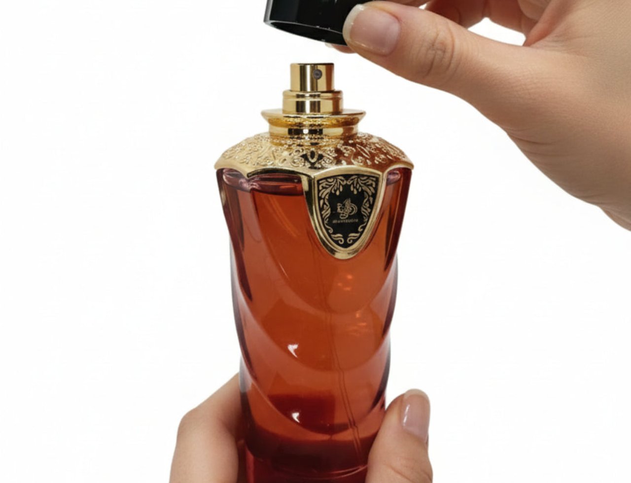 Al Wataniah Hayat by Al Wataniah 100ml EDP Unisex — Hand removing black cap from amber glass perfume bottle with gold ornate