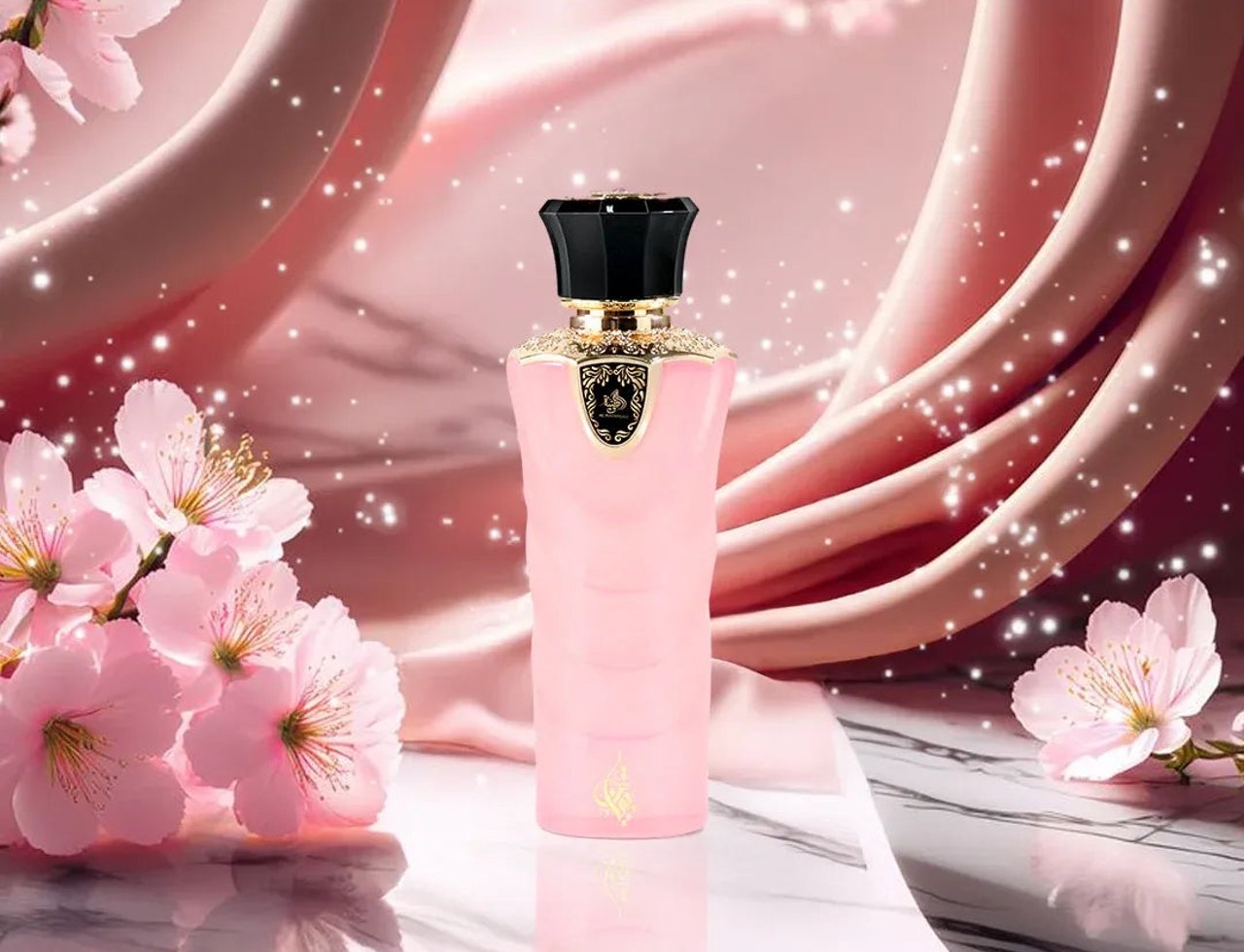 Al Wataniah Tibyan by Al Wataniah 100 ml EDP Women — Pink bottle with black cap, gold accents, surrounded by pink cherry