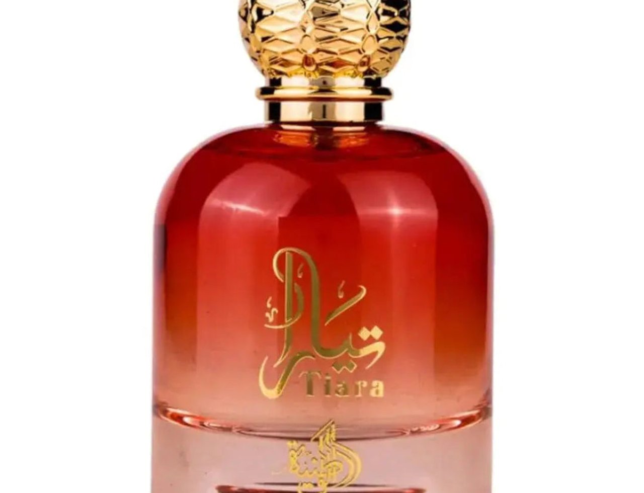 Al Wataniah Tiara – Red gradient glass perfume bottle with gold textured cap and gold Arabic script.
