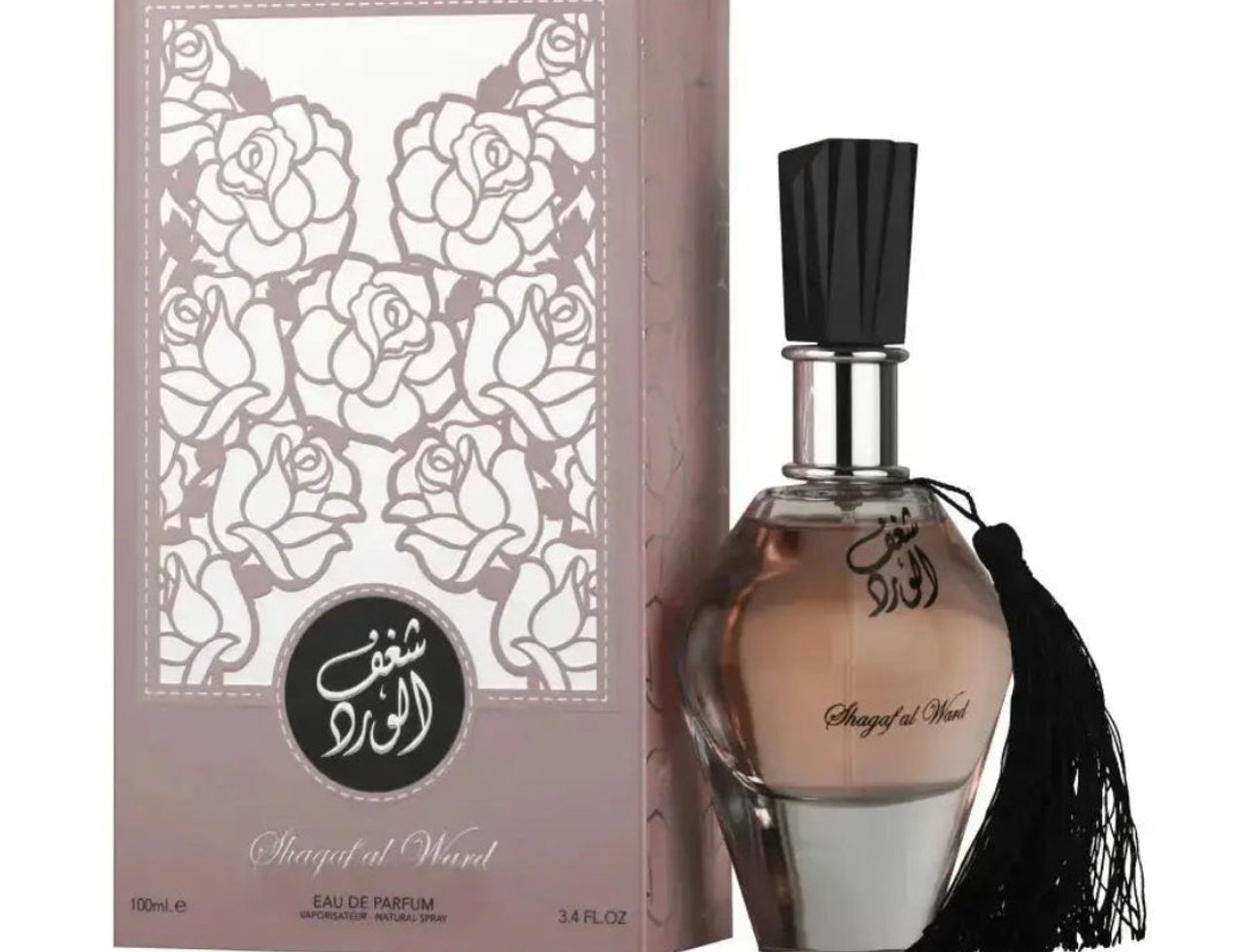 Al Wataniah Shagaf Al Ward — Pink floral patterned box next to a glass perfume bottle with a black tassel and black cap.