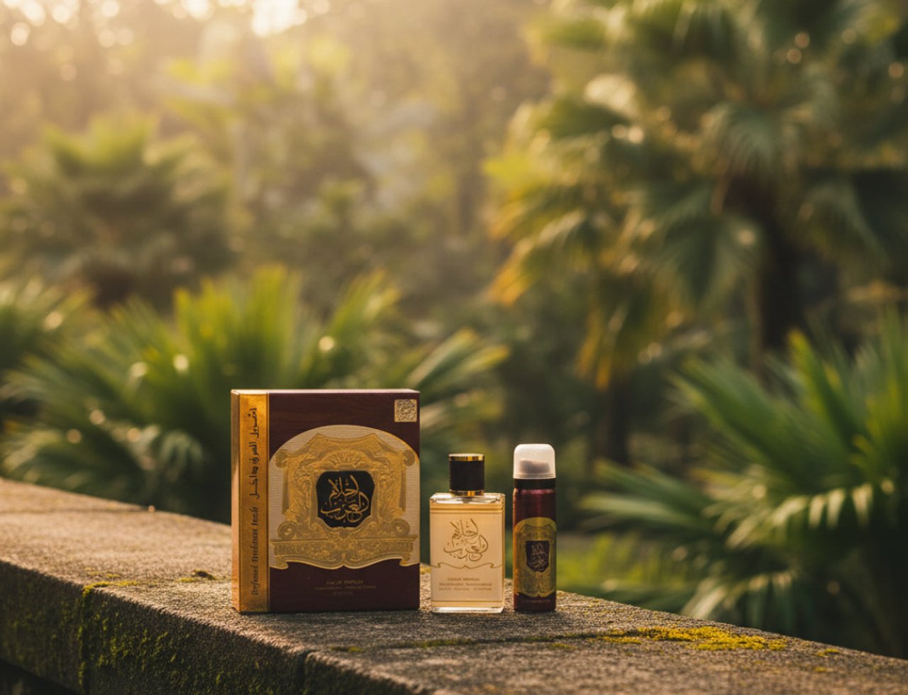 Ard Al Zaafaran Ahlam Al Arab EDP — Perfume box, bottle, and spray can on mossy stone wall with lush green trees background.