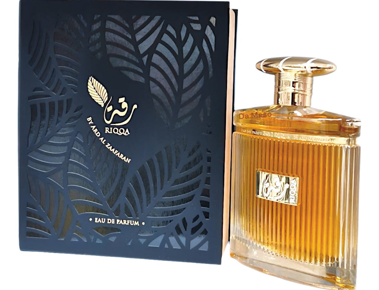 Ard Al Zaafaran Riqqa by Ard Al Zaafaran 100 ml EDP Men — Black patterned box with gold leaf design next to a fluted glass