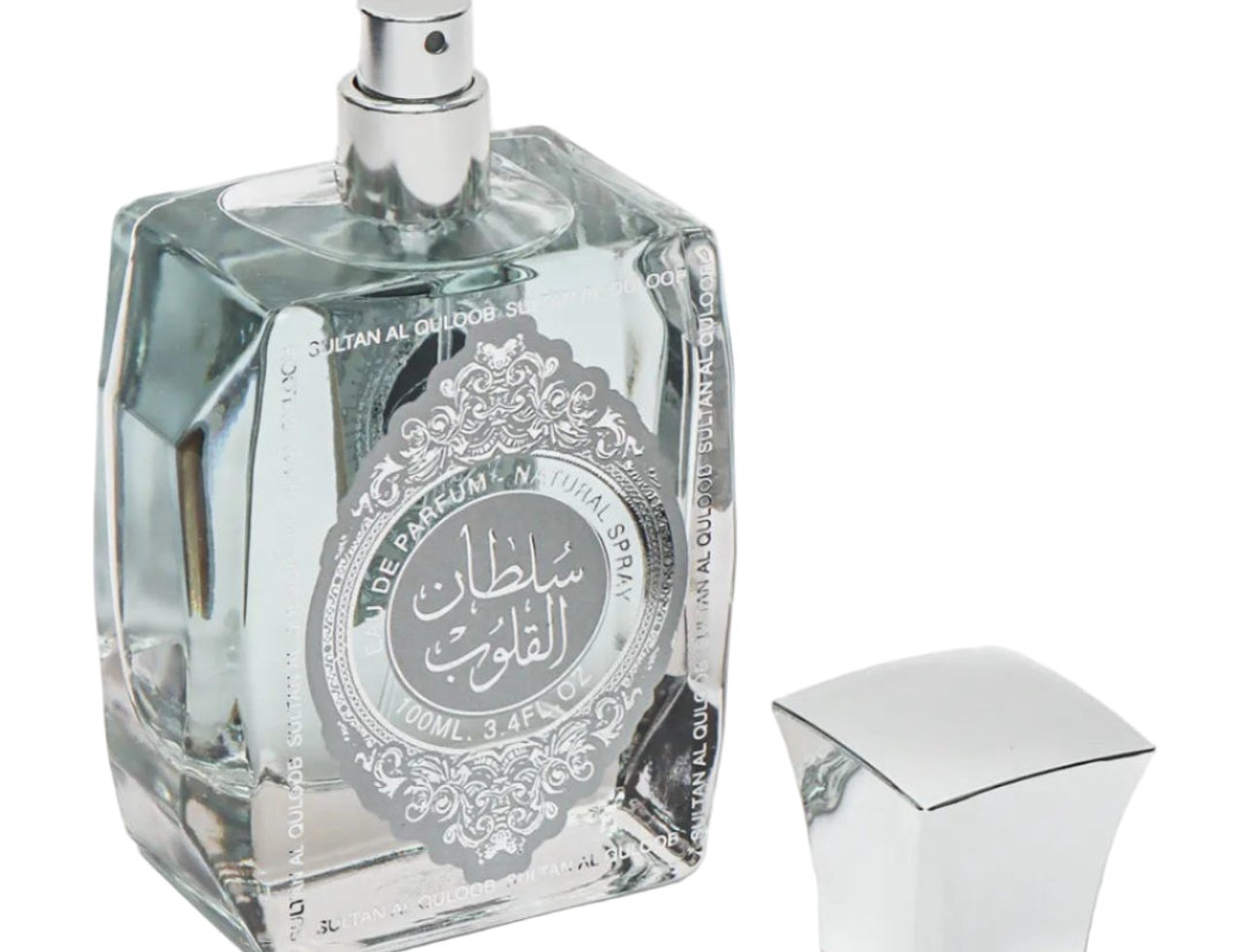Ard Al Zaafaran Sultan Al Quloub 100 ml EDP Men — Botol kaca segi empat lutsinar berisi cecair jernih, dengan penutup perak berkilat dan penutup botol berasingan di sebelah kanan.