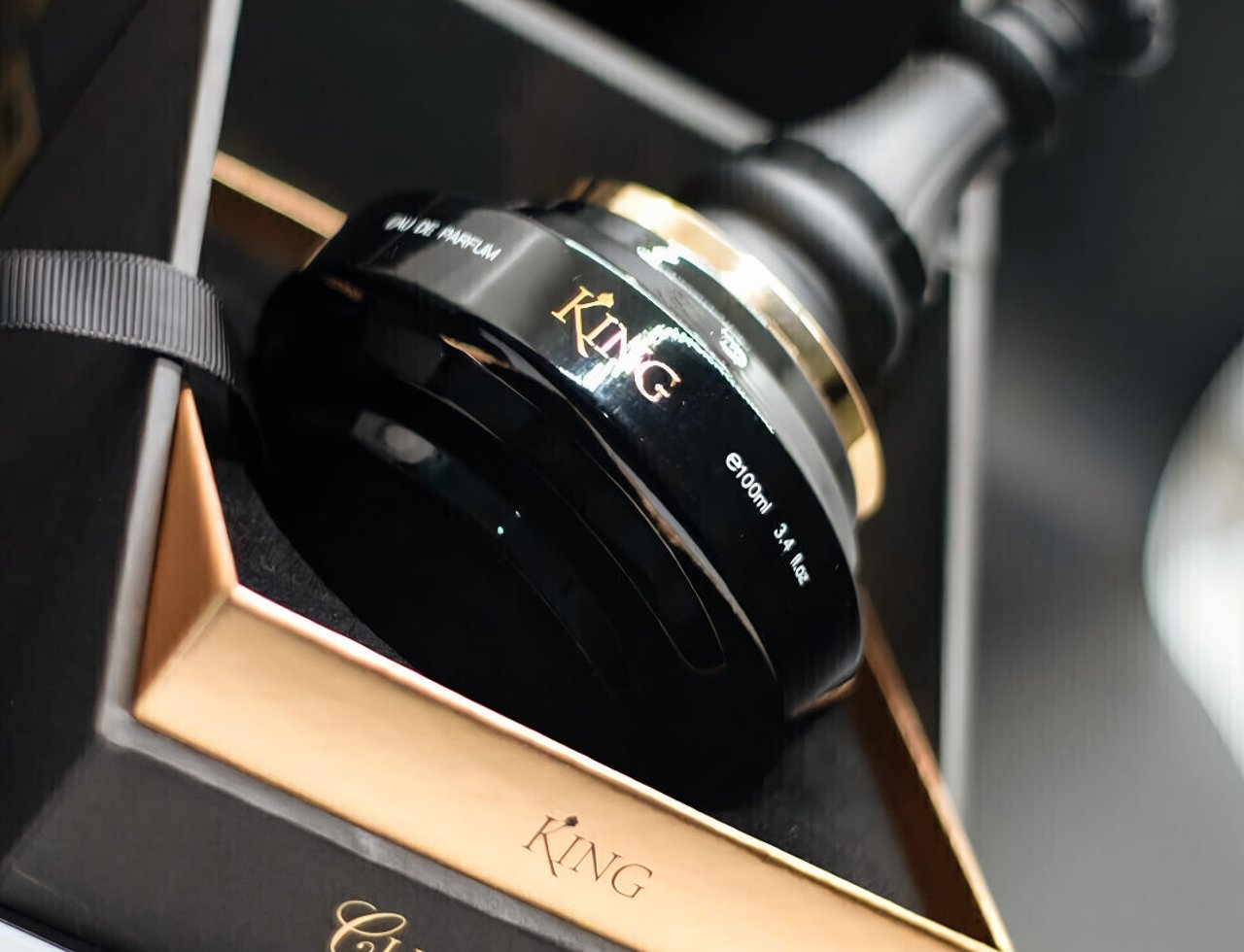 Armaf King Checkmate — Black chess king shaped perfume bottle with gold accents in a black and gold box