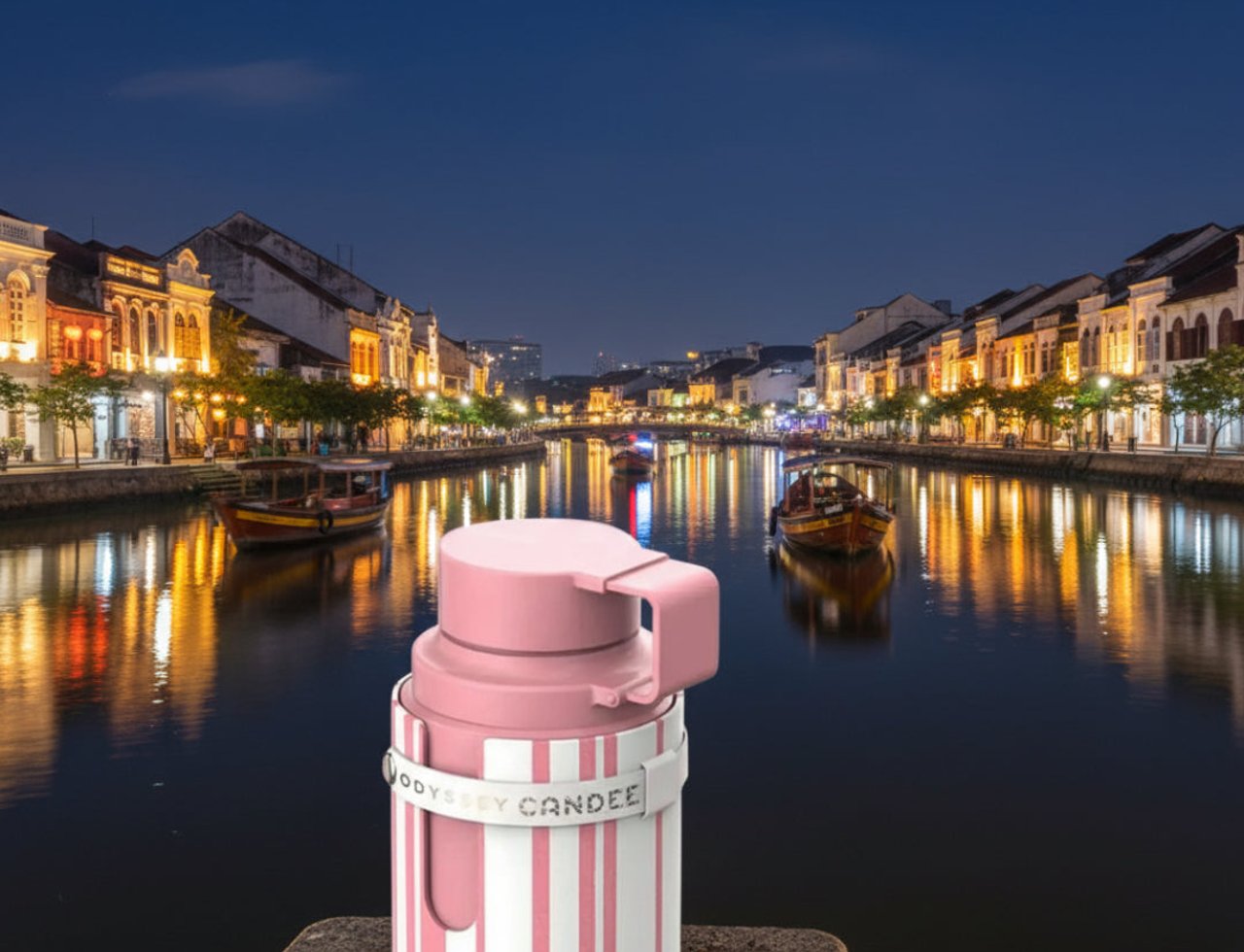 Armaf Odyssey Candee Special Edition by Armaf — Pink and white striped bottle with a white band, set against a nighttime