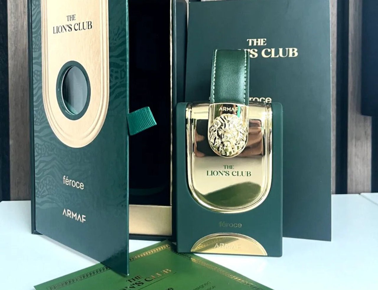 Armaf Feroce by Armaf 100ml EDP Women — Green box open, gold lion emblem bottle, and product card on white surface