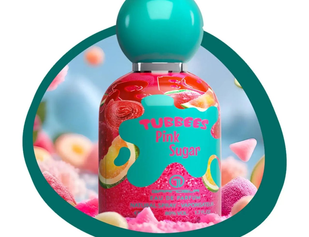 Grandeur Pink Sugar by Tubbees Grandeur – 50 ml for Her, a pink glittery perfume bottle with a teal cap, surrounded by colorful candy-like props and a teal oval frame.