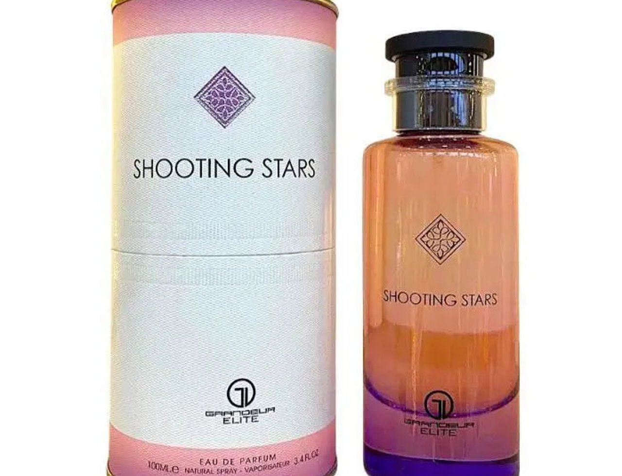 Grandeur Shooting Stars City by Grandeur Elite 100ml EDP — A cylindrical pink and white box with the "SHOOTING STARS" text and a diamond logo stands next to a tall, gradient pink and purple glass perfume bottle with a black cap.
