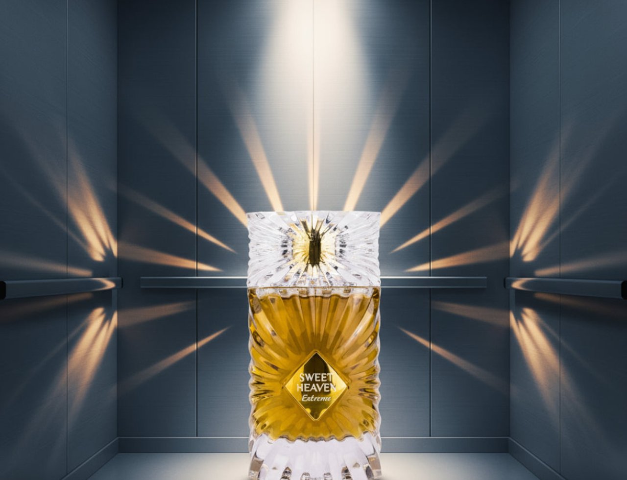 Gulf Orchid Sweet Heaven Extreme by Gulf Orchid 100ml Unisex — Amber liquid in a fluted glass bottle with a crystal-like cap, set in a modern elevator with dramatic light rays casting shadows.