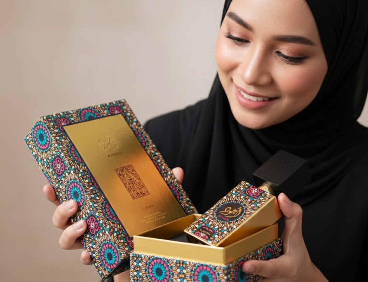 Lattafa Ajwad by Lattafa EDP 60ml Unisex — Woman in hijab opens ornate box revealing perfume bottle with intricate pattern