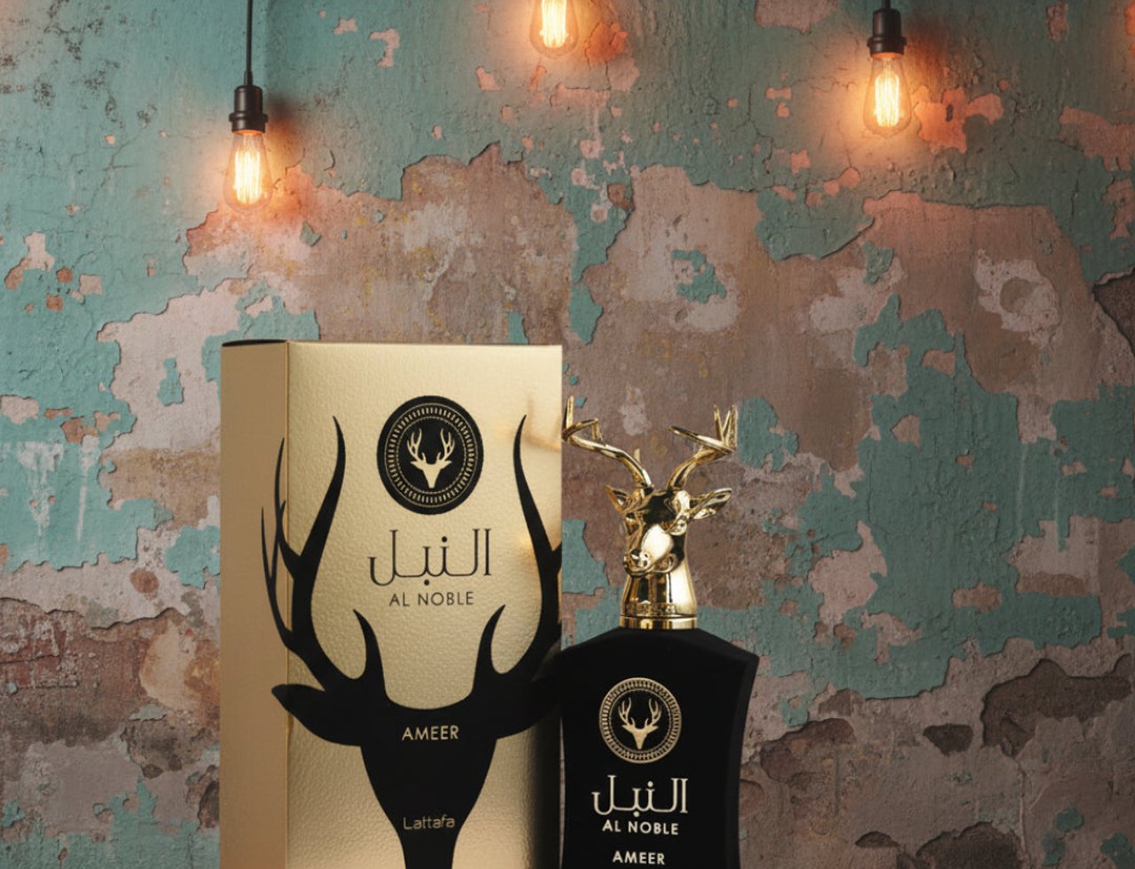 Lattafa Al Noble Ameer — Gold box and black bottle with deer head cap on rustic wall background with string lights