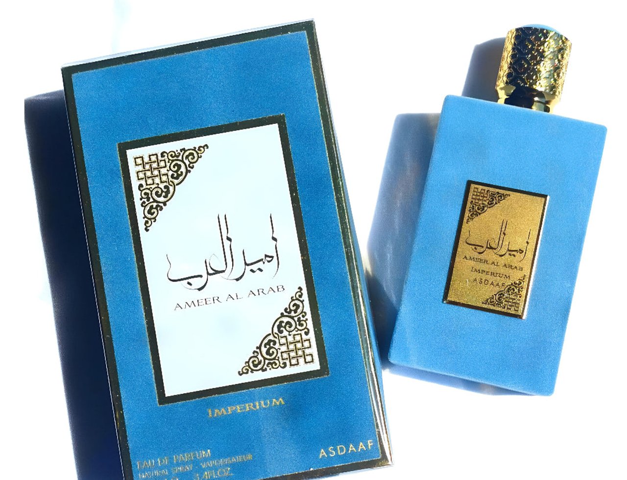 Lattafa Ameer Al Arab Imperium by Asdaaf — Blue perfume box and bottle with gold accents on a white background with shadows