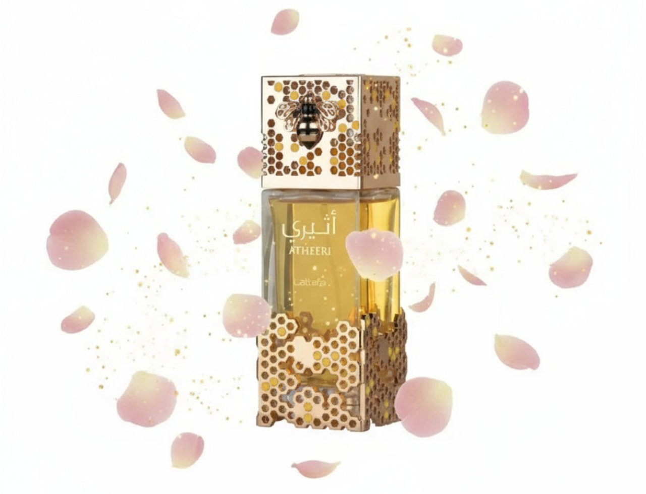 Lattafa Atheeri by Lattafa – 100 ml for Women — Botol wangian emas dengan reka bentuk sarang lebah dan lebah hiasan, dikelilingi kelopak bunga merah jambu dan serpihan emas
