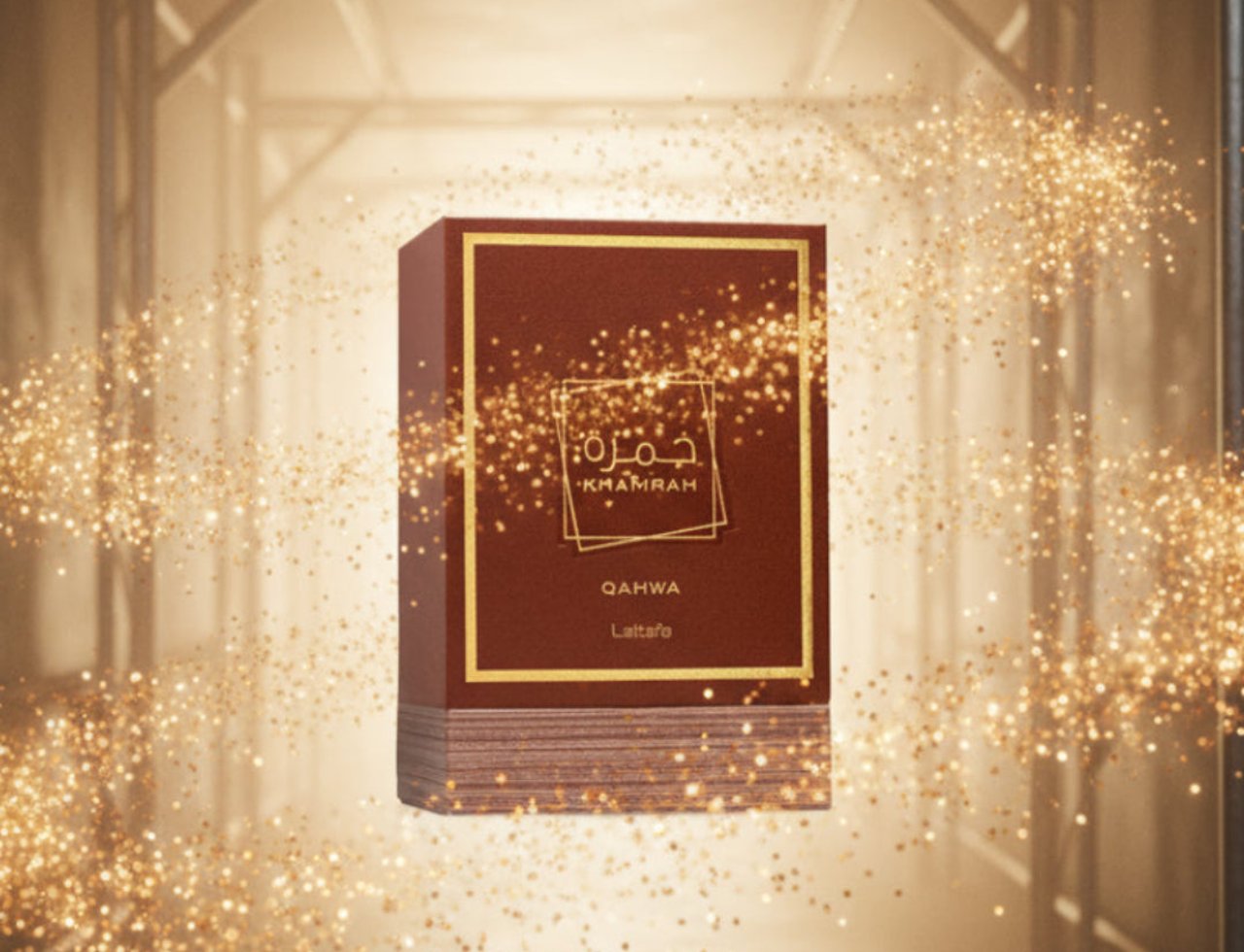 Lattafa Khamrah Qahwa by Lattafa 100ml EDP Unisex — A stack of maroon perfume boxes with gold trim and Arabic calligraphy, surrounded by sparkling gold glitter in a tunnel-like setting.