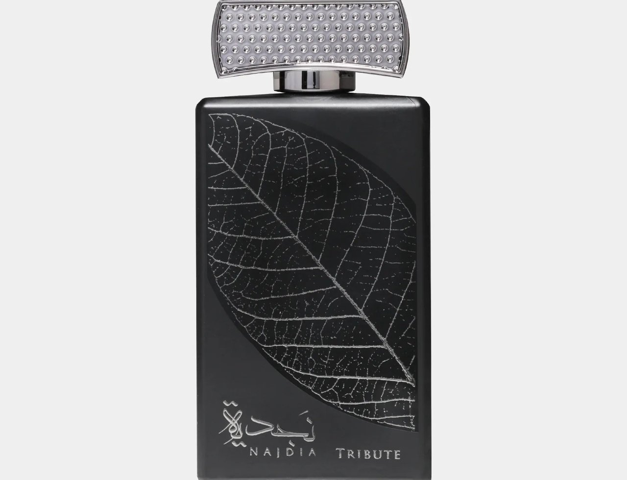Lattafa Najdia Tribute by Lattafa 100ml EDP — Black perfume bottle with a silver leaf design and Arabic calligraphy, topped with a textured silver cap.