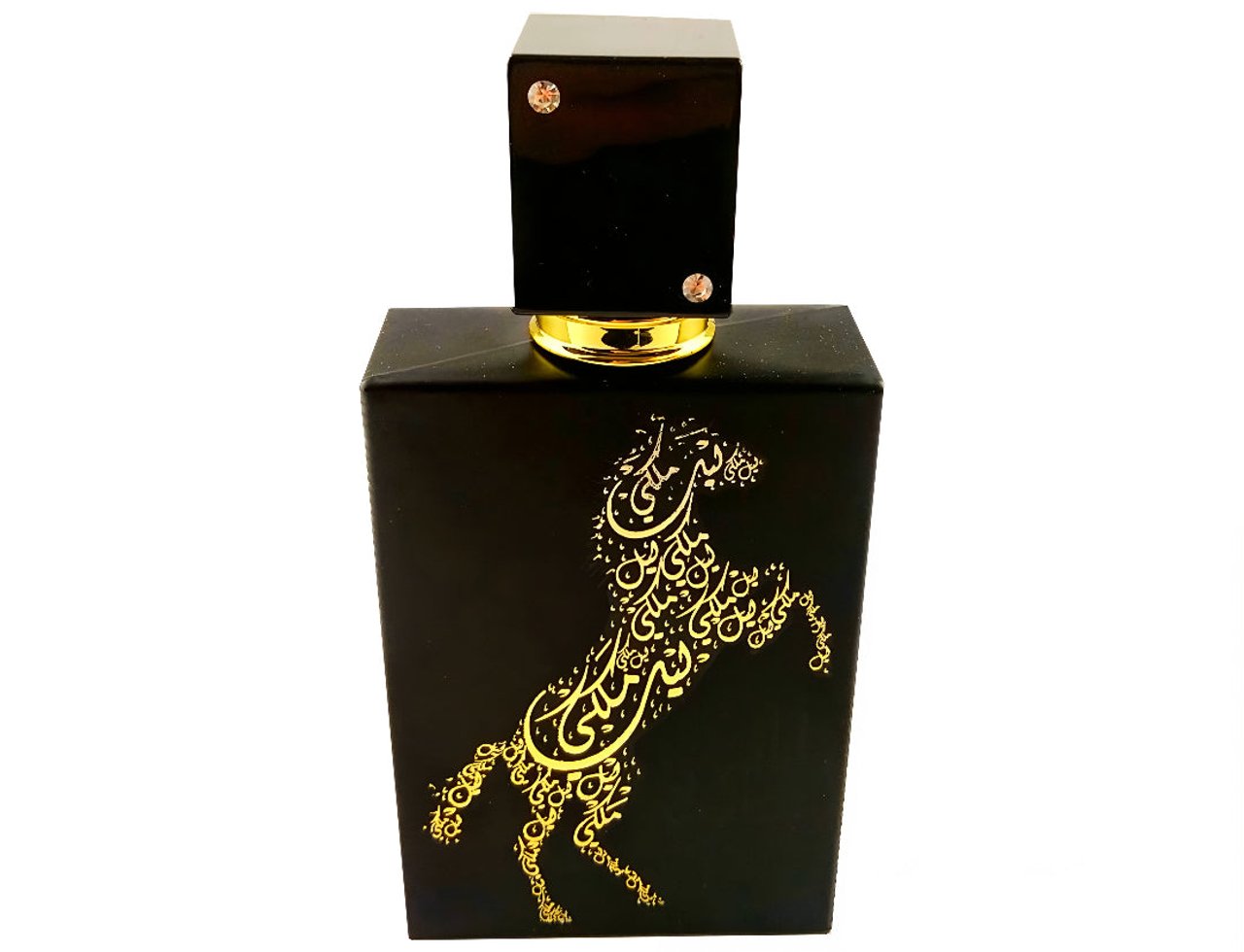 Lattafa Lail Maleki by Lattafa 100ml EDP Unisex — Black perfume bottle with gold Arabic calligraphy horse design, gold cap with two small crystals