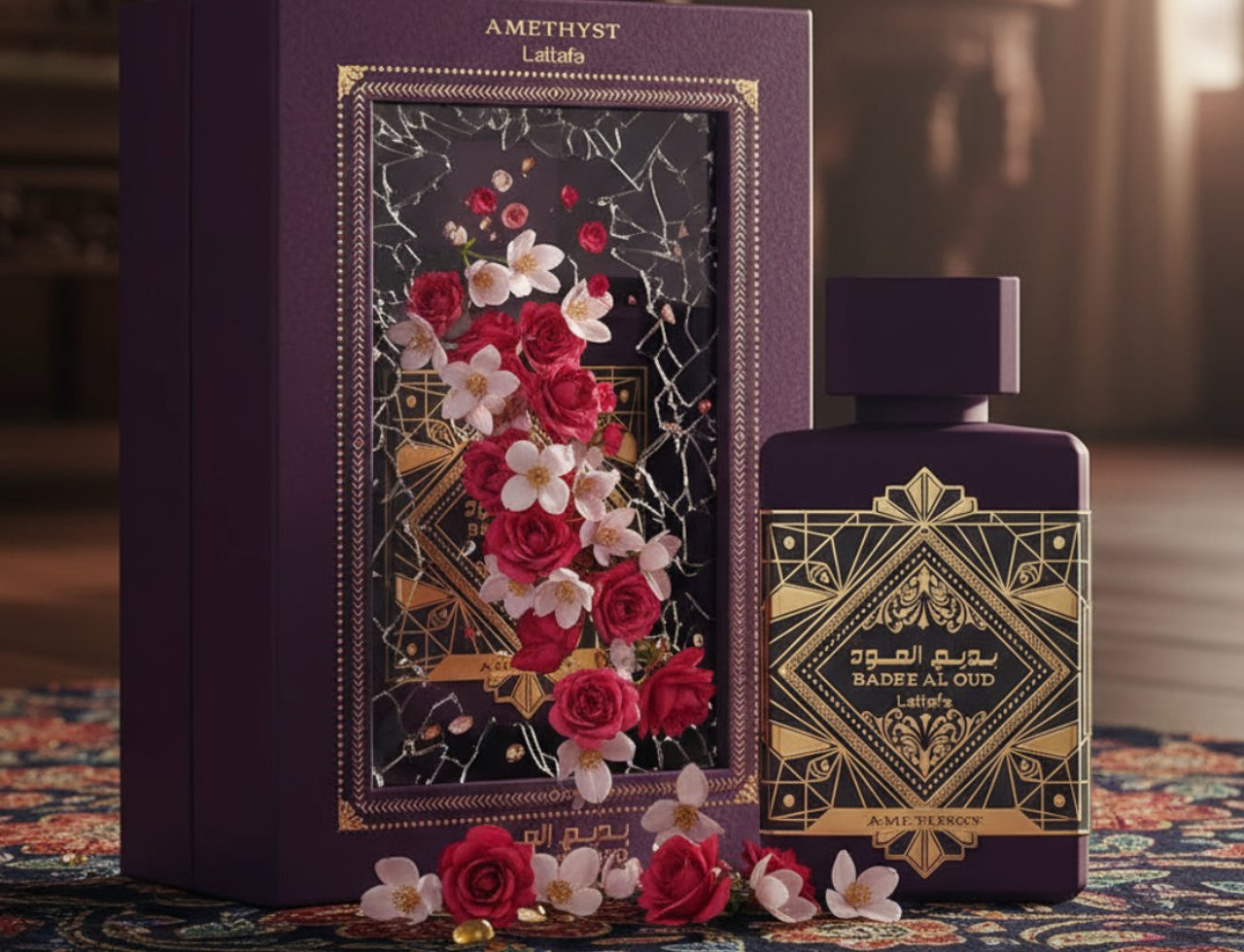 Lattafa Badee Al Oud Amethyst — Purple box with floral design and gold accents next to a purple perfume bottle on a