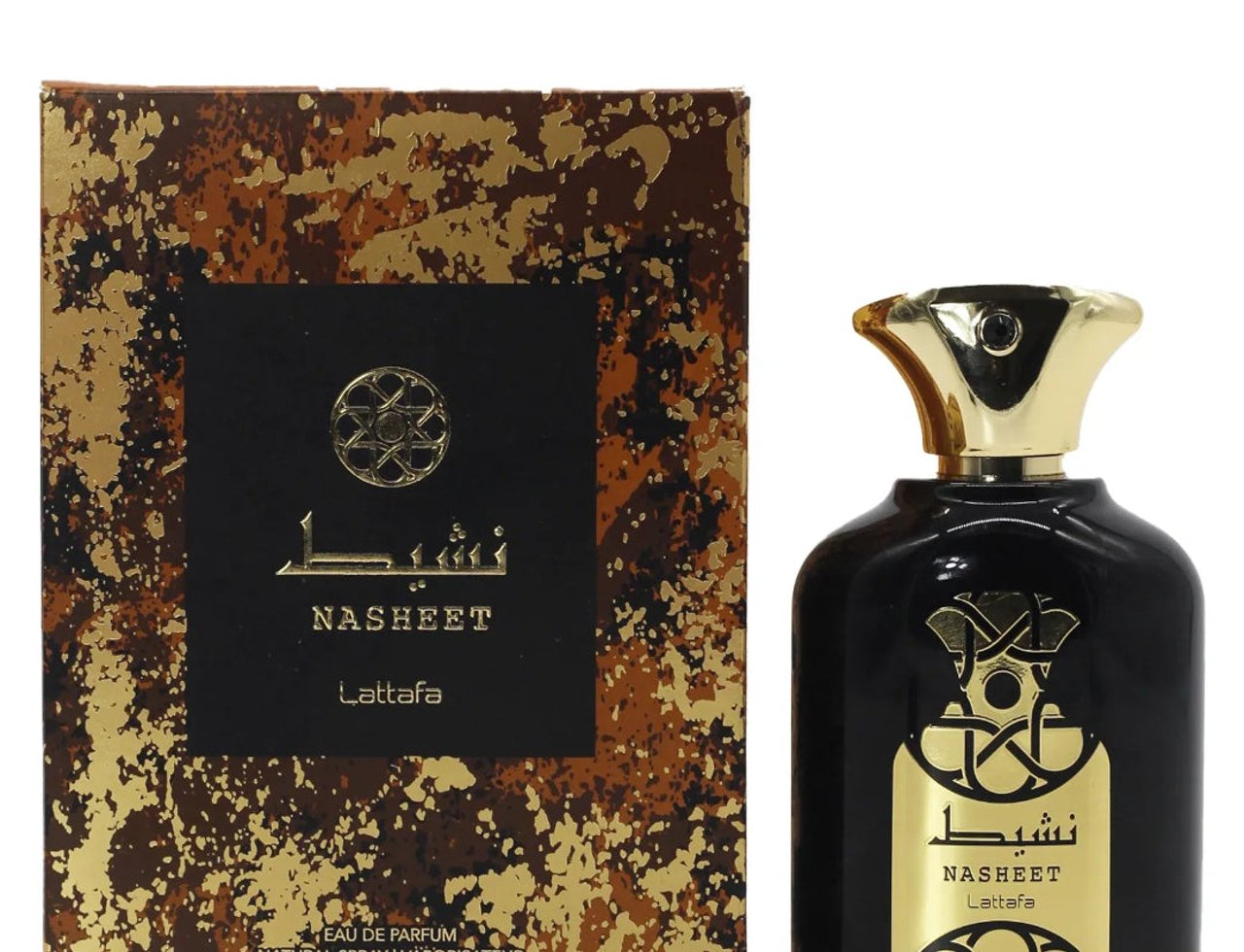 Lattafa Nasheet by Lattafa Perfume 100ml EDP Unisex — Botol minyak wangi hitam bertutup emas dan label emas berhias, bersebelahan dengan kotak bercorak coklat dan emasnya.