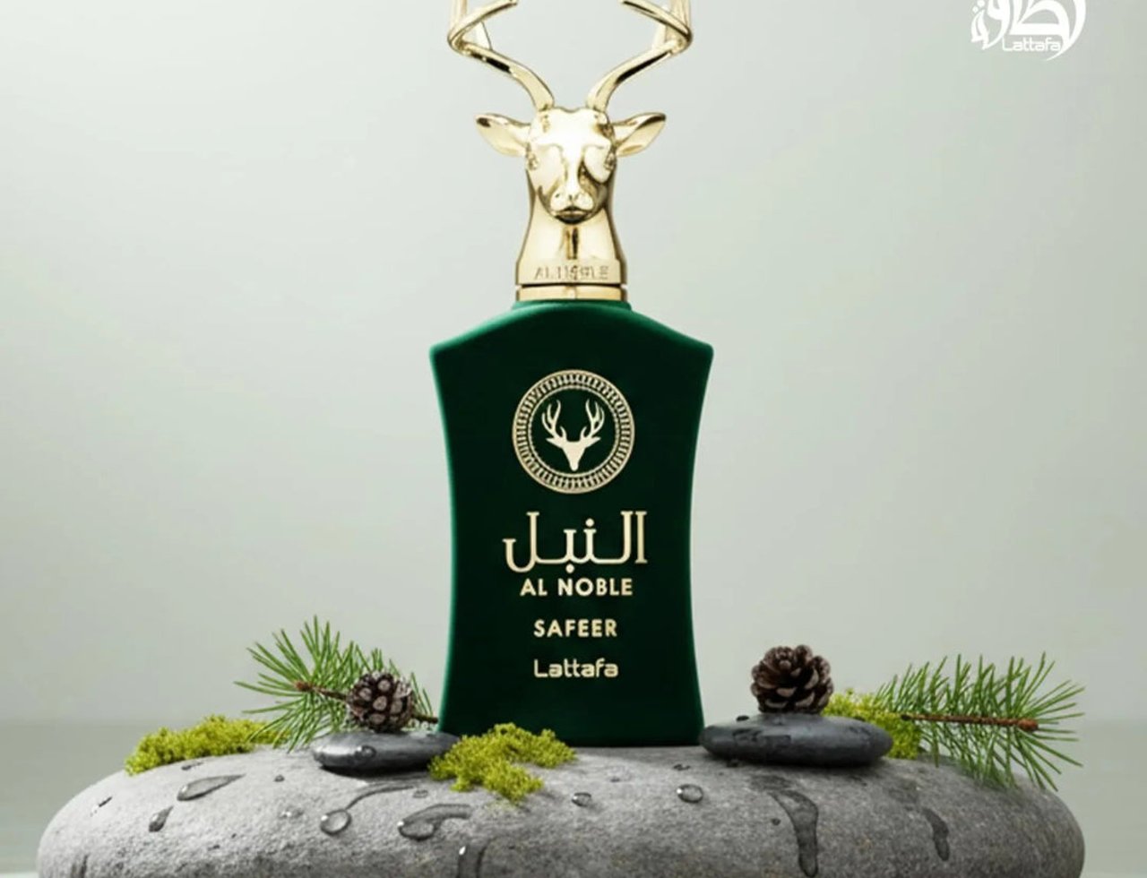 Lattafa Safeer by Lattafa Al Noble 100ml EDP — Green velvet bottle with gold deer head cap, displayed on wet rocks with pine sprigs and cones.