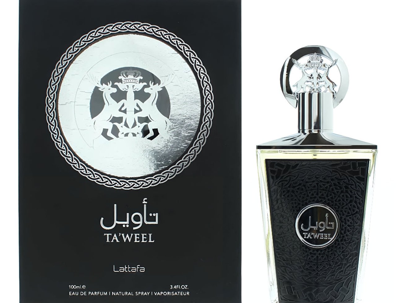 Lattafa Taweel 100ml EDP Unisex — Black perfume box with silver intricate design and Arabic script, next to a clear glass perfume bottle with a silver cap and black textured detailing.