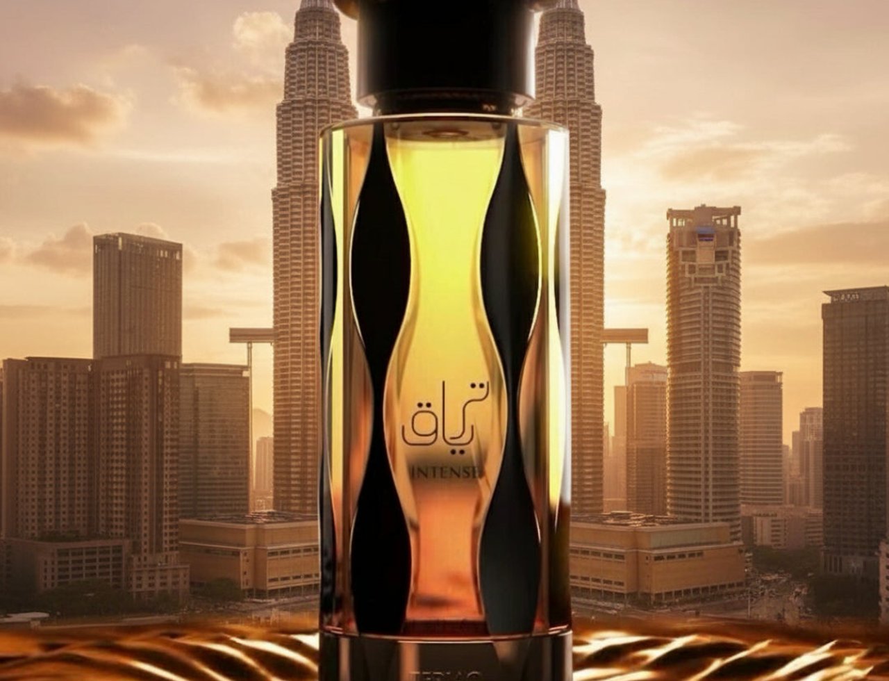 Lattafa Teriaq Intense by Lattafa 100ml Eau de Parfum — A tall, ornate perfume bottle with gold and black accents, filled with golden liquid, stands in front of a city skyline at sunset, with a rippling gold surface in the foreground.