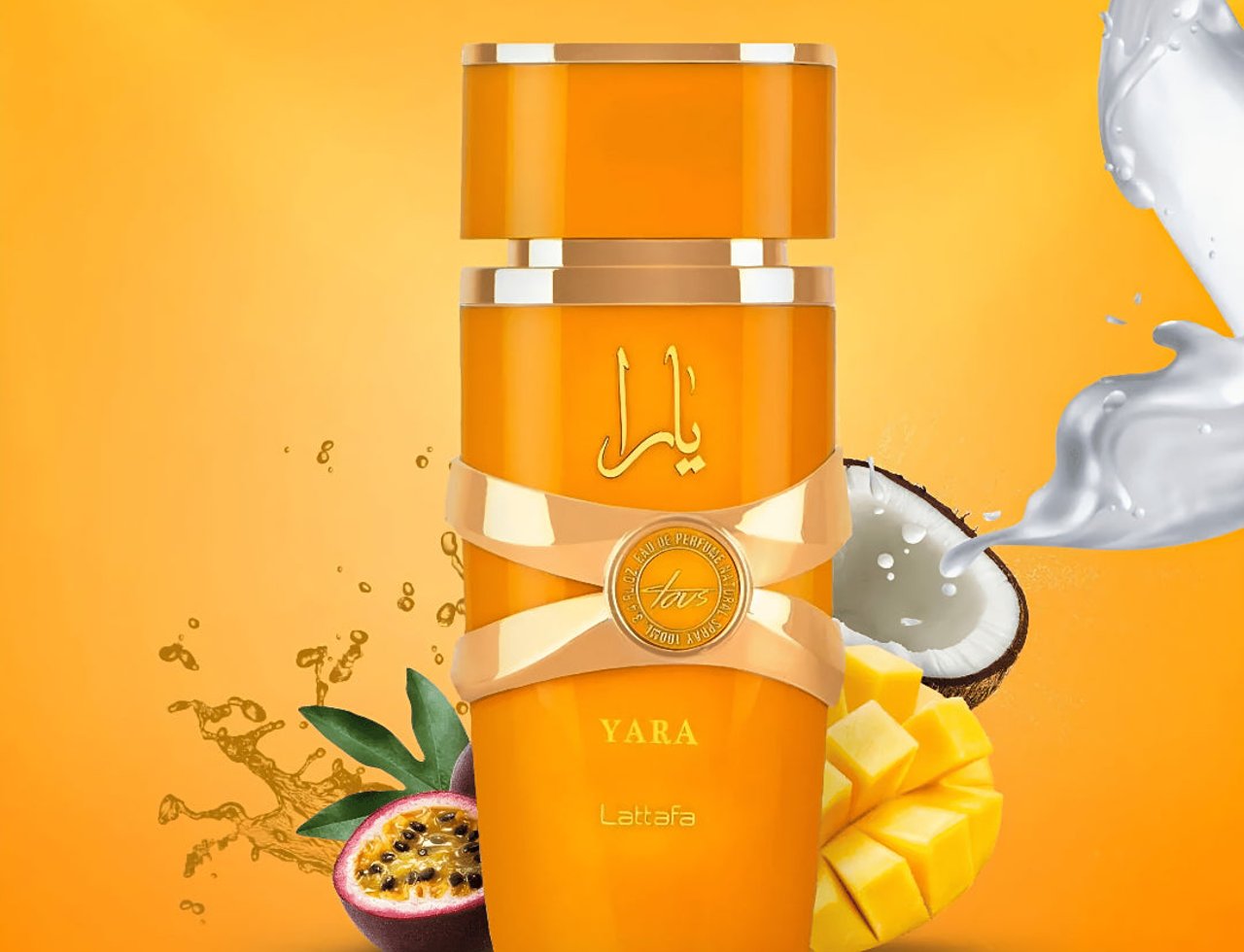 Lattafa Yara Tous by Lattafa 100ml EDP Women — Orange perfume bottle with gold accents, ribbon detail, and Arabic script, surrounded by passion fruit, mango cubes, coconut, and splashing liquid against a vibrant orange background.