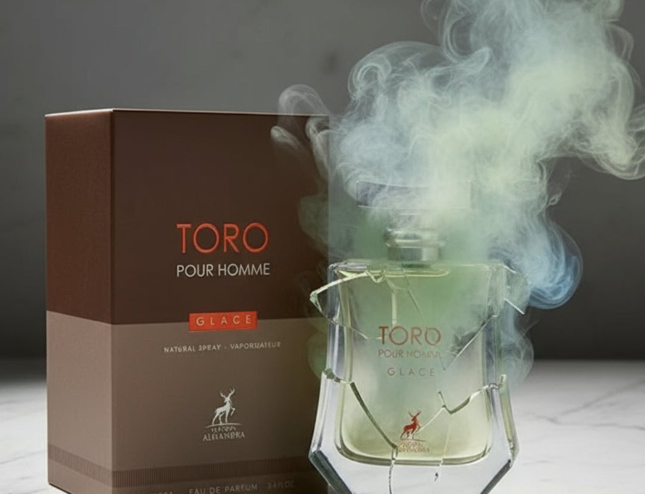Maison Alhambra Toro Pour Homme Glace – A glass perfume bottle with green liquid, surrounded by swirling white and blue smoke, next to its brown box packaging.