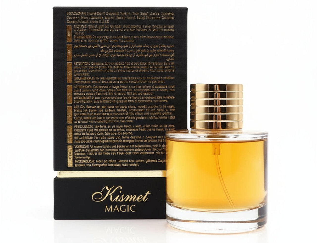Maison Alhambra Kismet Magic by Maison Alhambra 100ml EDP Unisex — Botol minyak wangi kaca bertutup emas dengan cecair keemasan, diletakkan di atas kotak hitam bertulis teks dan logo 'Kismet Magic'.