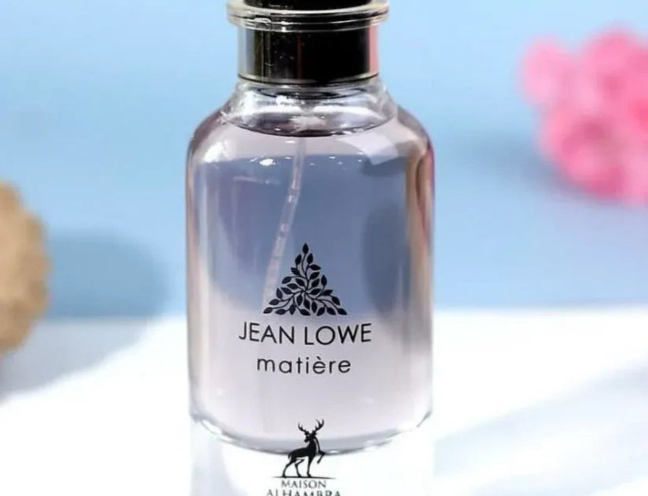 Maison Alhambra Jean Lowe Matiere — Clear glass perfume bottle with a black cap, showing the clear liquid inside. The label features black text and a deer silhouette.