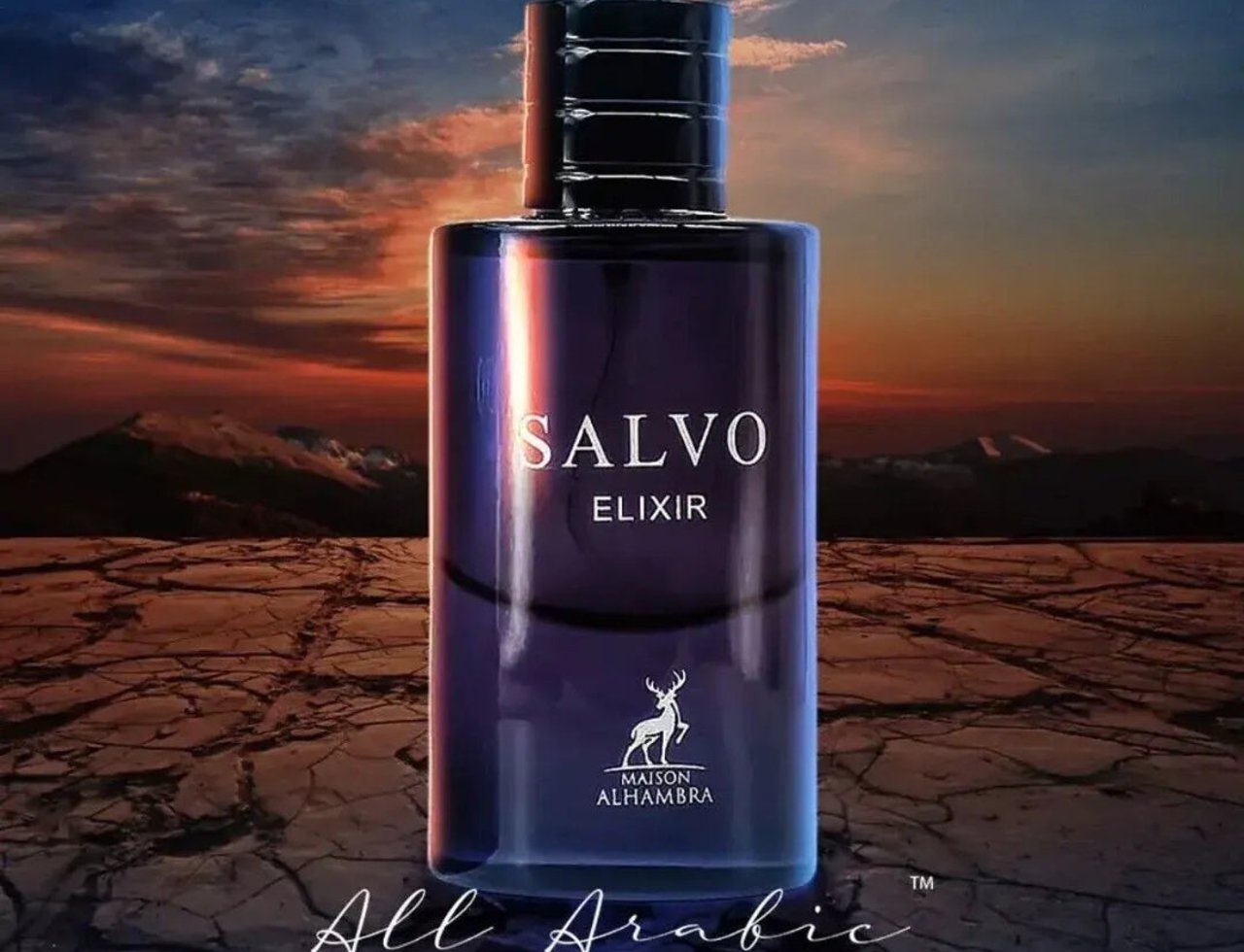 Maison Alhambra Salvo Elixir — A dark purple glass perfume bottle with a black cap, set against a dramatic sunset sky and cracked earth landscape.