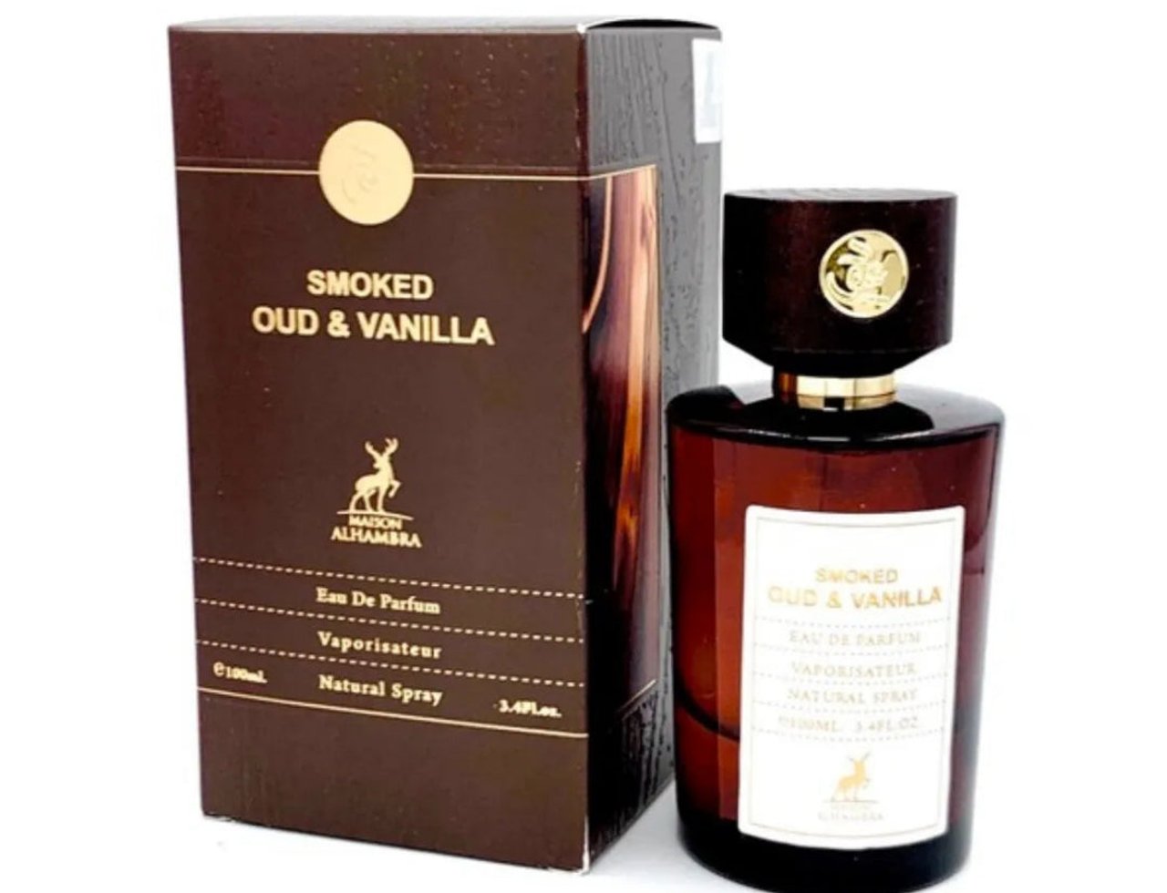 Maison Alhambra Smoked Oud & Vanilla 100ml EDP — Kotak coklat dan botol minyak wangi kaca gelap dengan aksen emas dan penutup kayu, label putih dengan butiran produk