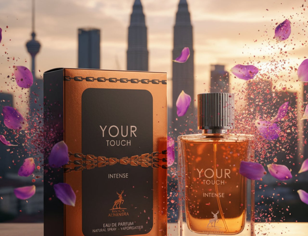 Maison Alhambra Your Touch Intense by Maison Alhambra 100ml — Perfume bottle and box with petals and confetti against a city skyline at sunset.