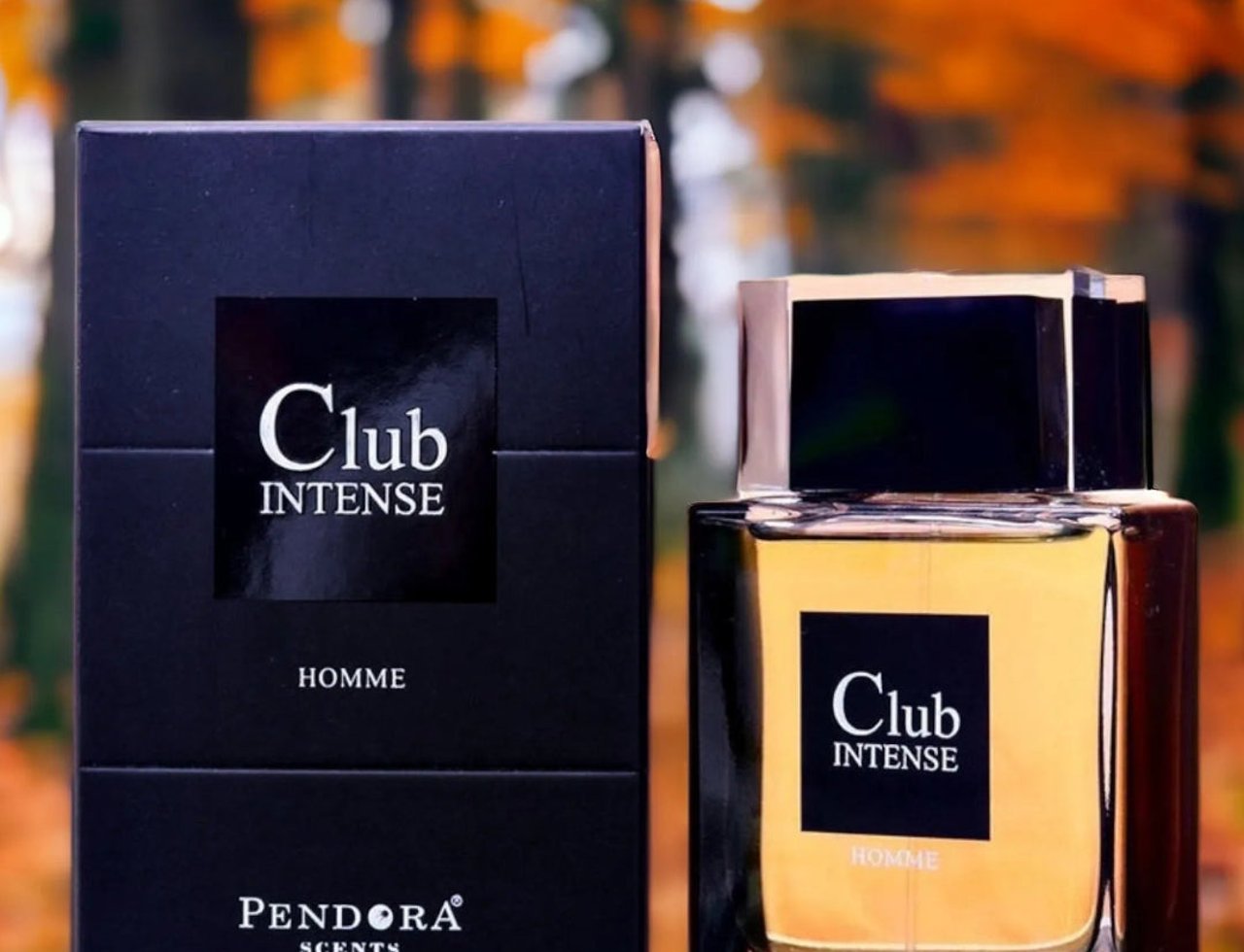 Pendora Club Intense 100ml EDP Men Paris Corner Pendora — Black box and golden glass perfume bottle with black cap, set against an autumn forest background.