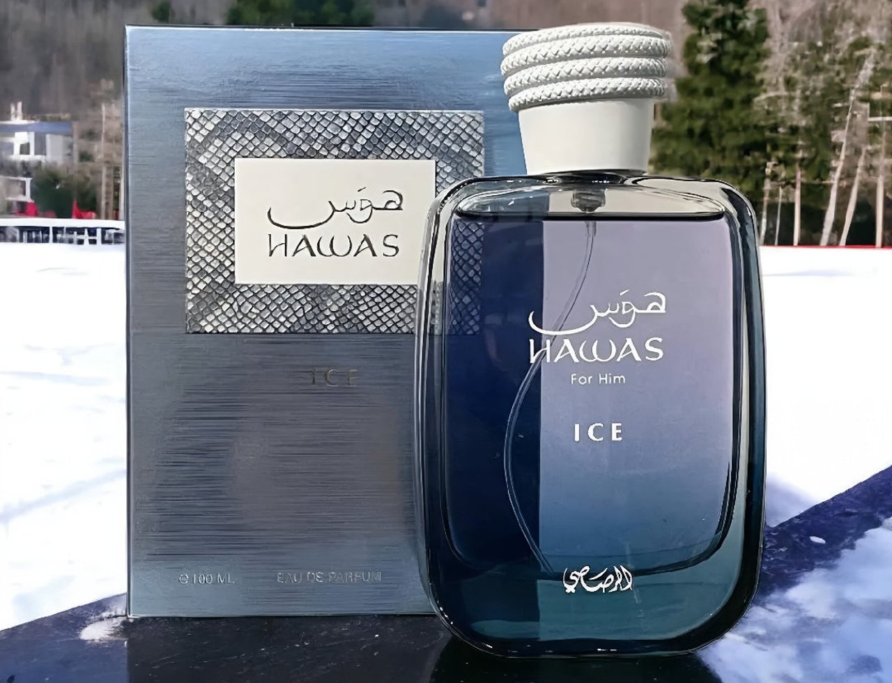 Rasasi Rasasi Hawas Ice 100ml Eau de Parfum for Men — Blue glass perfume bottle and matching box with silver snake-skin texture, set against a snowy, wooded landscape.