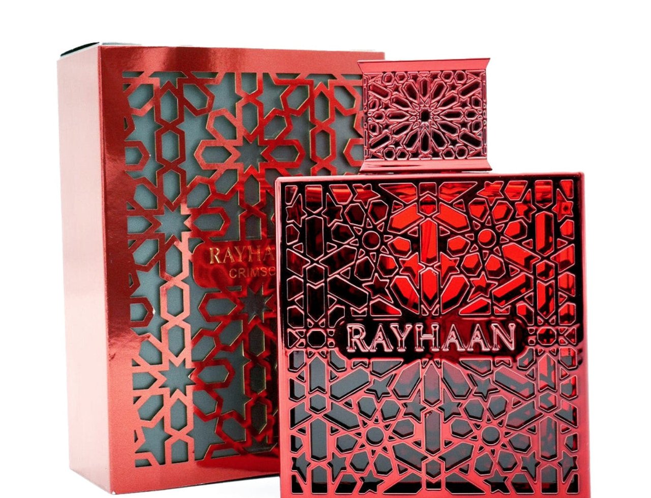 Rayhaan Crimson for Men 100ml — Botol dan kotak pewangi merah corak geometri dengan potongan rumit, memaparkan nama jenama 'RAYHAAN' dengan jelas pada botol.