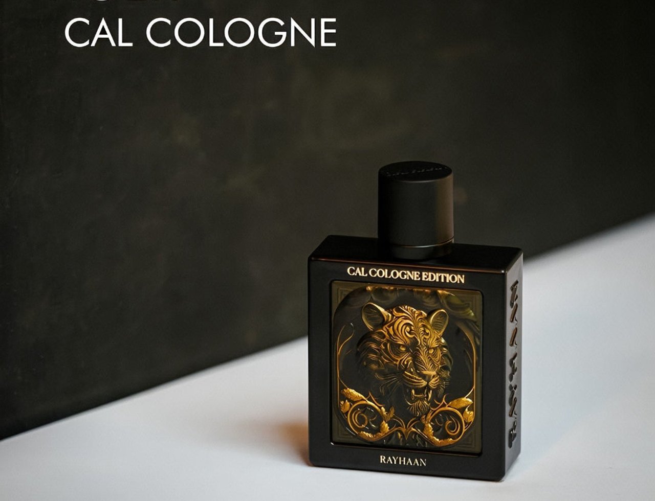 Rayhaan Tiger Cal Cologne — Black bottle with gold tiger emblem and "CAL COLOGNE EDITION" text, set against a dark textured background and white surface.