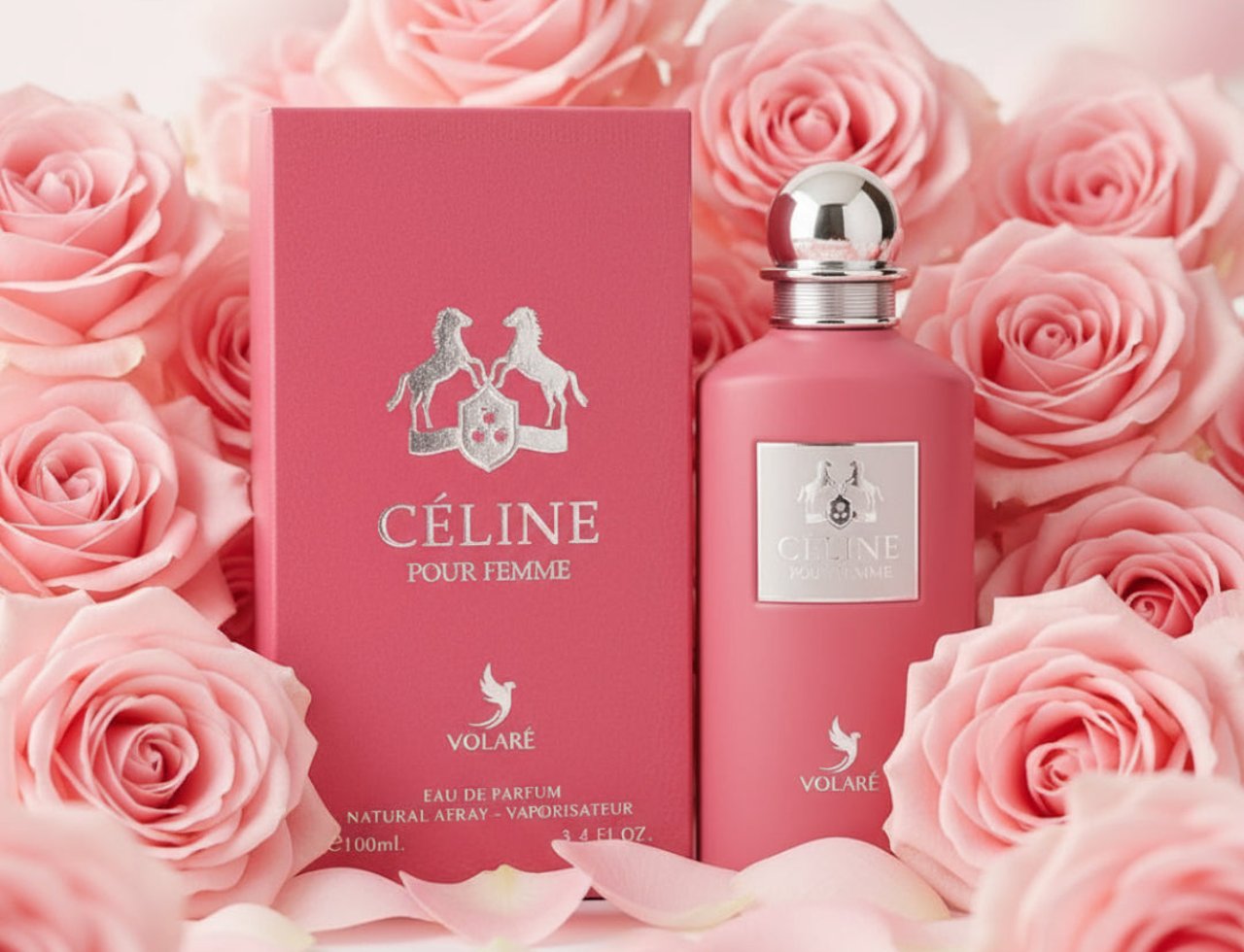 Volare Celine pour Femme — Botol dan kotak minyak wangi merah jambu dikelilingi bunga ros merah jambu lembut dan kelopak.