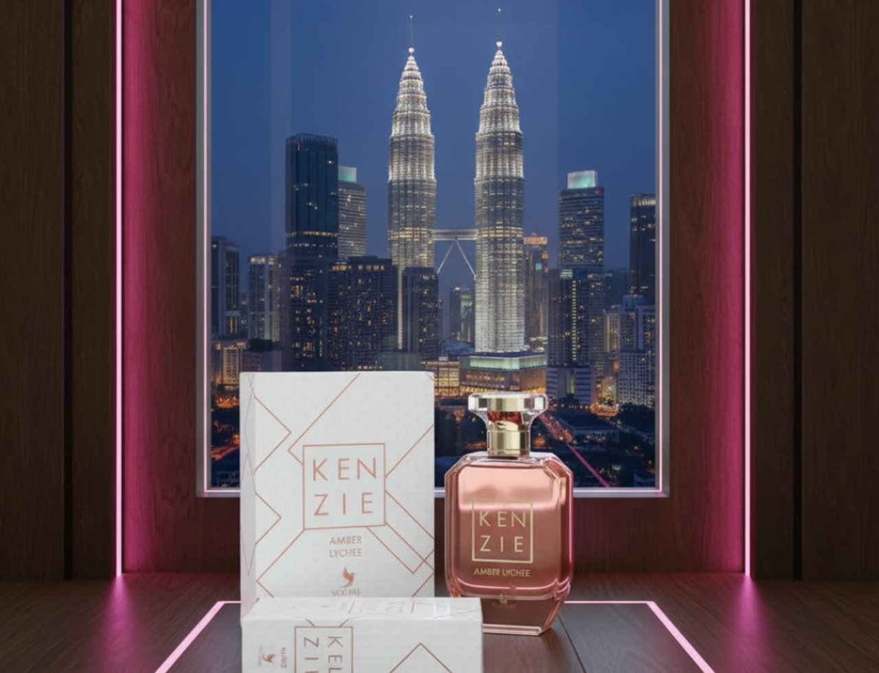 Volare Amber Lychee Kenzie by Volare – 100 ml for Her perfume bottle and box set displayed against a city skyline at night, with pink neon lighting.
