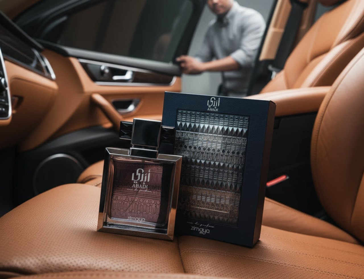 Abadi Opulent by Zimaya EDP 100ml Men — A man in a grey shirt opens a car door, with a bottle and box of Abadi Opulent by Zimaya perfume placed on the tan leather car seat. | Abadi Opulent by Zimaya EDP 100ml Men — Seorang lelaki berbaju kelabu membuka pintu kereta, dengan sebotol dan kotak minyak wangi Abadi Opulent