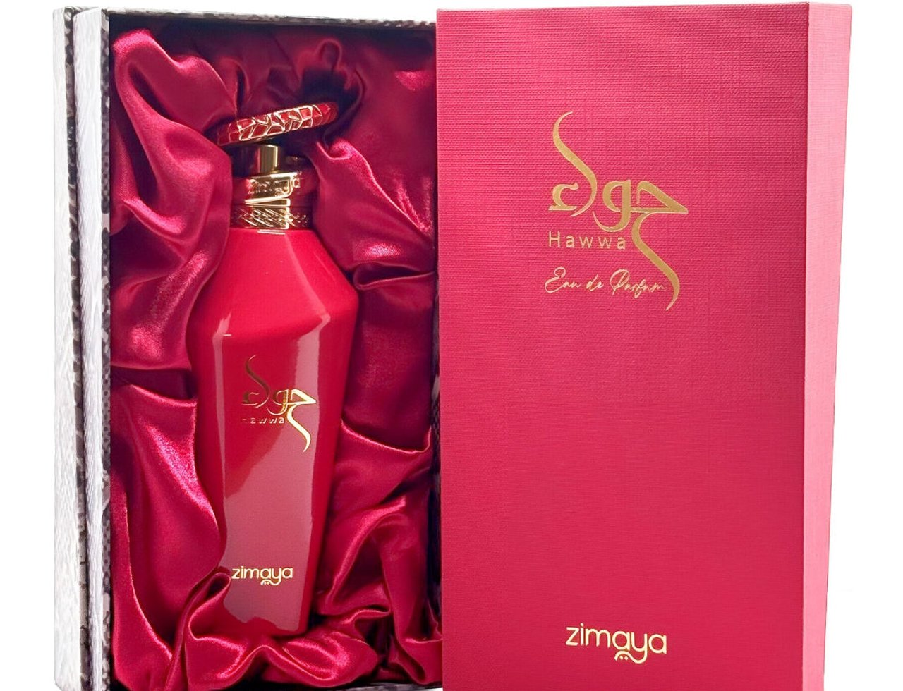 Zimaya Hawwa Red by Zimaya 100ml EDP Women — Botol minyak wangi merah dengan perincian emas di dalam kotak berlapik satin merah, bersama kotak hadiah merah sepadan dengan tulisan Arab emas.