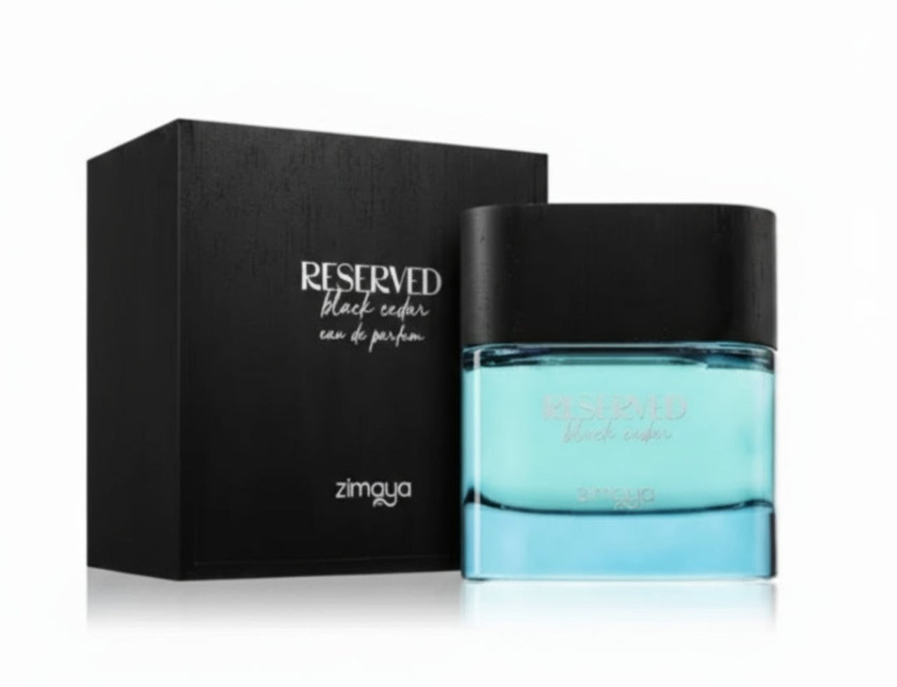 Zimaya Reserved Black Cedar by Zimaya EDP 100 ml — Black textured box and clear blue glass perfume bottle with black cap, set against a white background.