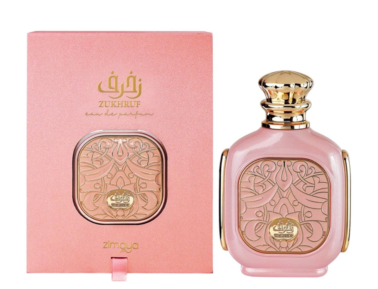 Zimaya Zukhruf Femme Pink by Zimaya 100ml EDP Women — Pink perfume bottle with gold accents and intricate gold design on the front, next to its matching pink textured box with gold Arabic calligraphy and text.