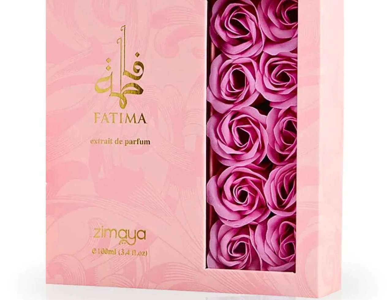 Zimaya Fatima by Zimaya 100ml Extrait de Parfum Women — Kotak merah jambu dengan tingkap memaparkan hiasan sabun mawar merah jambu, kaligrafi Arab emas dan teks.