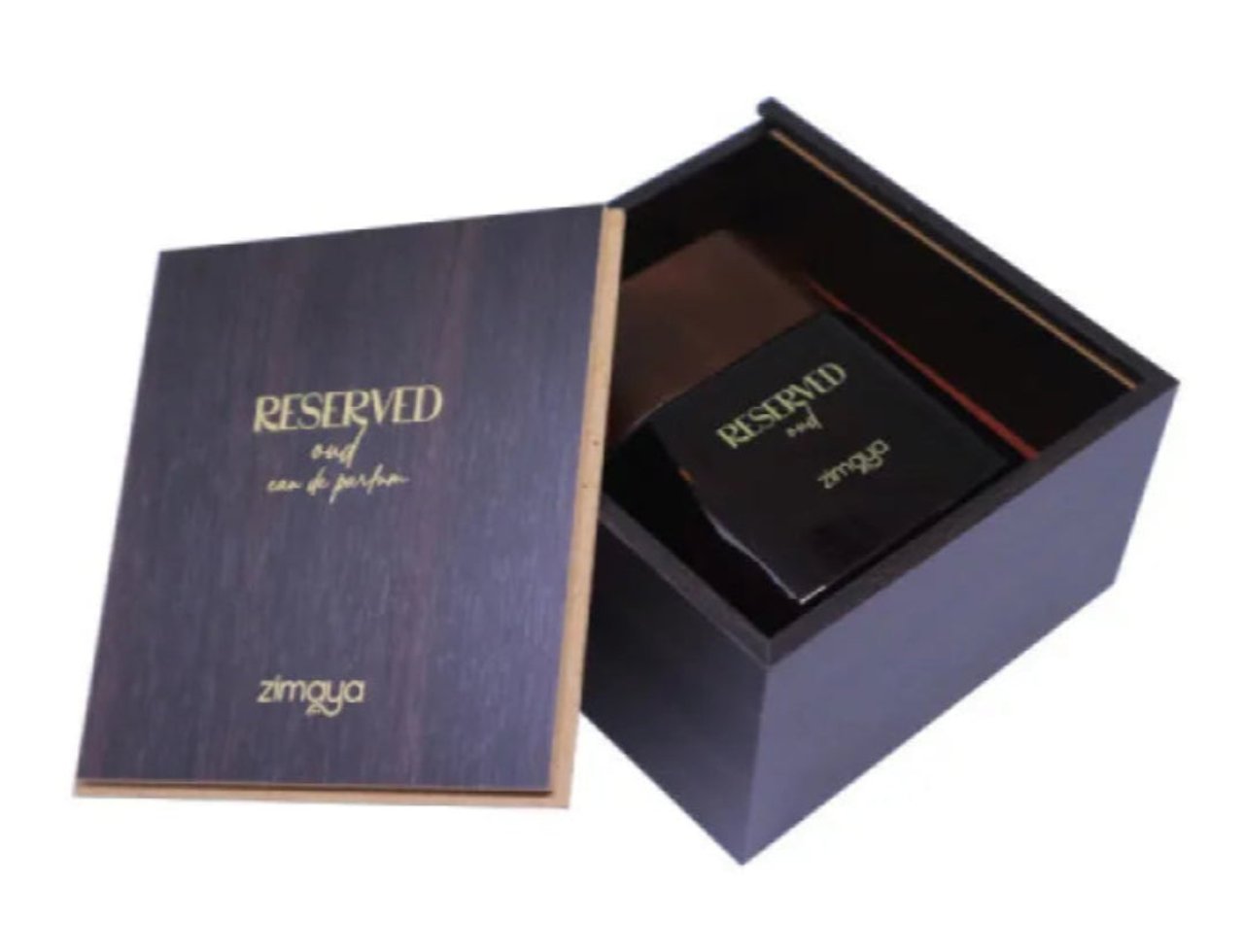 Zimaya Reserved Oud EDP 100 ml Unisex — Kotak kayu gelap dengan penutup terbuka, memaparkan botol minyak wangi kaca gelap dengan teks emas. Penutupnya tertulis 'RESERVED oud eau de parfum' dan 'zimaya'.