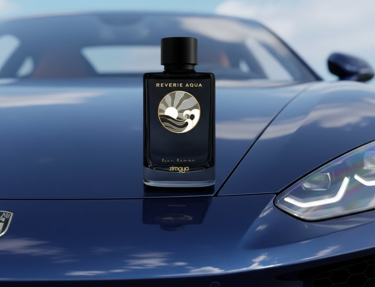 Zimaya Reverie Aqua oleh Zimaya 100ml EDP Lelaki — Botol minyak wangi hitam dengan lambang matahari dan ombak emas, diletakkan di atas hud kereta sport mewah berwarna biru gelap.