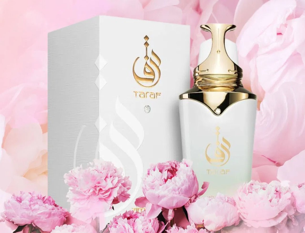 Zimaya Taraf White by Zimaya 100ml EDP Women — White perfume bottle and box with gold accents, surrounded by pink peonies.