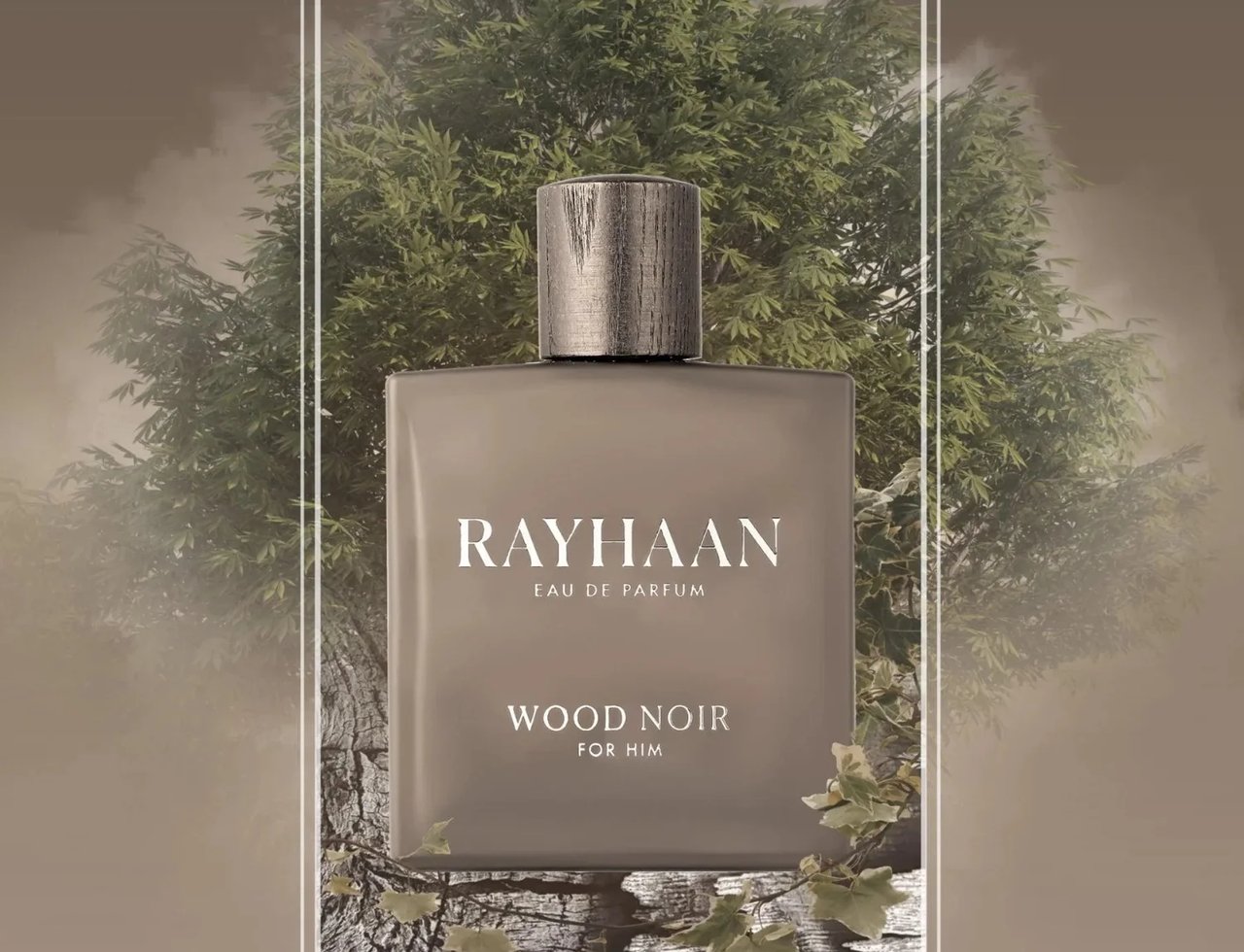 Rayhaan Woody Noir Eau De Parfum 100ml — A square, grey perfume bottle with a wooden cap sits on a textured, dark surface with fallen leaves, set against a blurred background of green trees and smoky mist. | Rayhaan Woody Noir Eau De Parfum 100ml — Botol minyak wangi kelabu bersisi empat dengan penutup kayu diletakkan