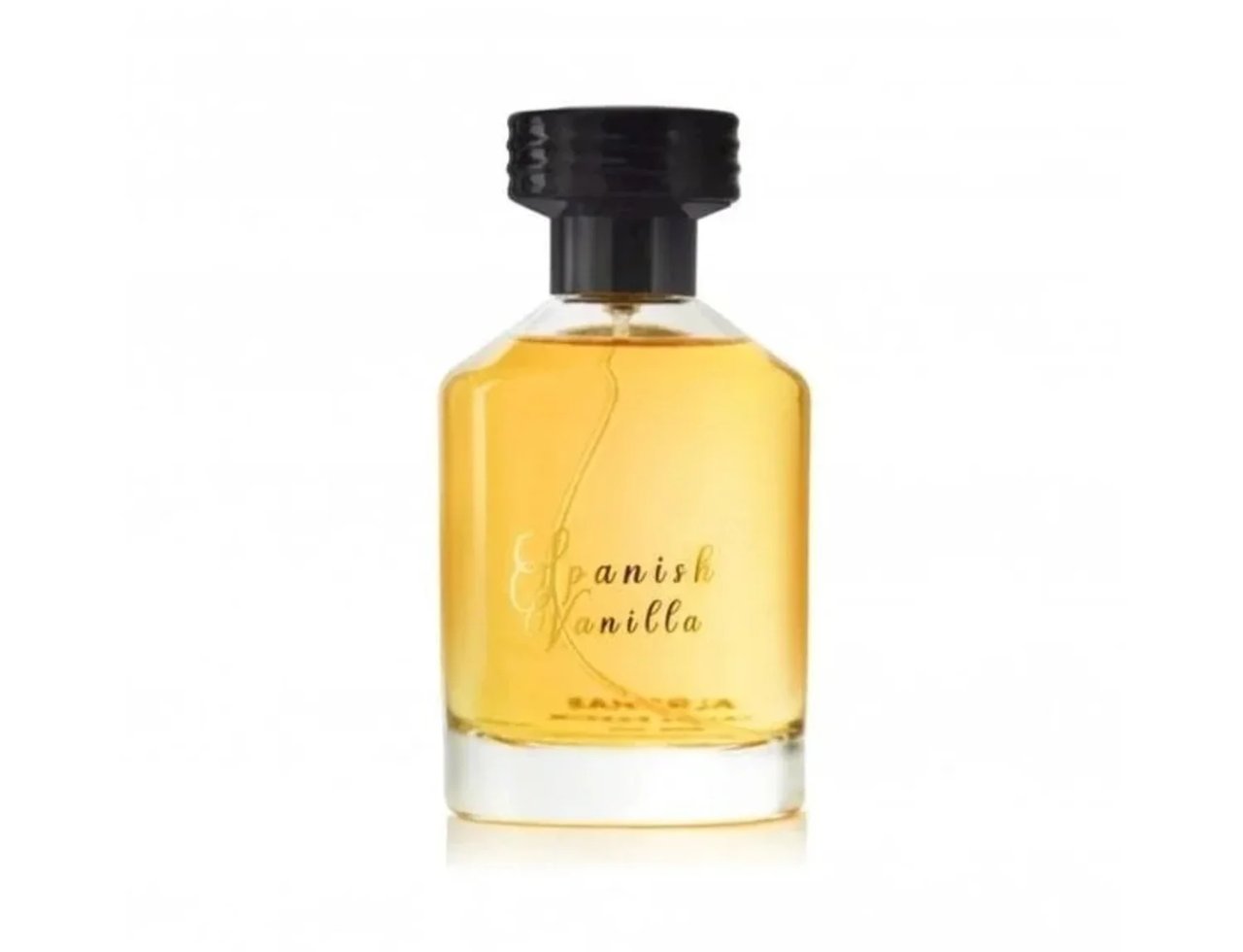 Al Rehab Spanish Vanilla Eau De Parfum 100ml — A clear glass perfume bottle with golden liquid and a black cap, featuring gold text that reads 'Spanish Vanilla' on the front. | Al Rehab Spanish Vanilla Eau De Parfum 100ml — Botol kaca jernih dengan cecair keemasan dan penutup hitam, menampilkan teks emas bertulis