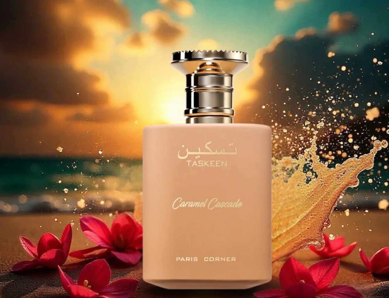Paris Corner Taskeen Caramel Cascade 100ml — A peach-colored perfume bottle sits on a sandy beach with red flowers scattered around it, against a sunset sky and ocean waves. | Paris Corner Taskeen Caramel Cascade 100ml — Botol pewangi berwarna pic duduk di pantai berpasir dengan bunga merah bertaburan di